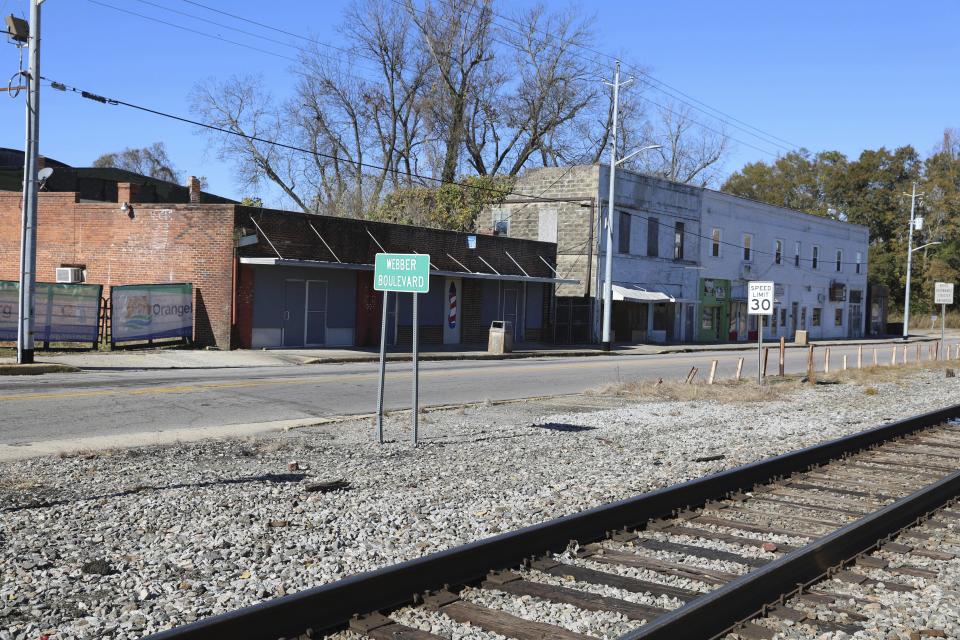 Abandoned buildings that will be torn down for a new museum by South Carolina civil rights photographer Cecil Williams are seen on Tuesday, Dec. 12, 2023, in Orangeburg, South Carolina. (AP Photo/Jeffrey Collins)