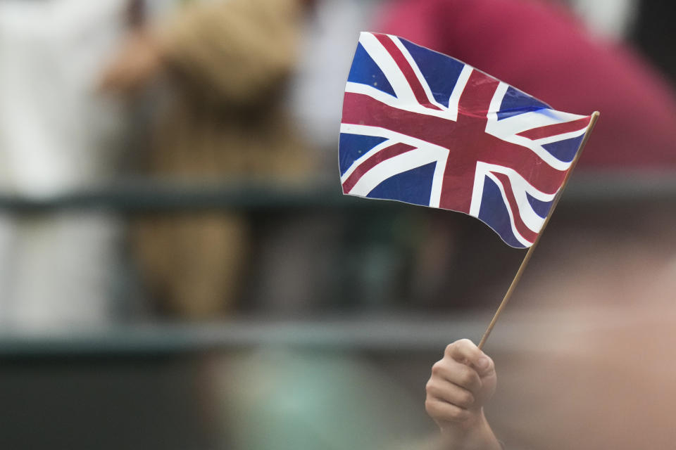 Supporters of Britain's Emma Raducanu react after her win over Elise Mertens of Belgium in their match on day three at the Wimbledon tennis championships in London, Wednesday, July 3, 2024. (AP Photo/Mosa'ab Elshamy)