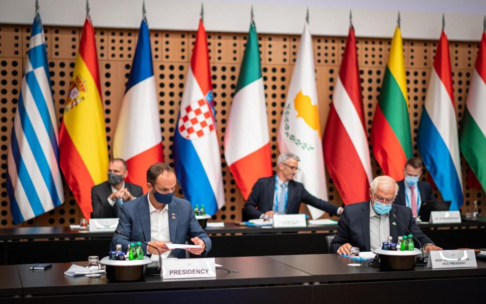 EU foreign ministers at the start of an informal meeting on Friday to discuss the creation of a 5,000-strong rapid reaction force - Jure Makovec/AFP