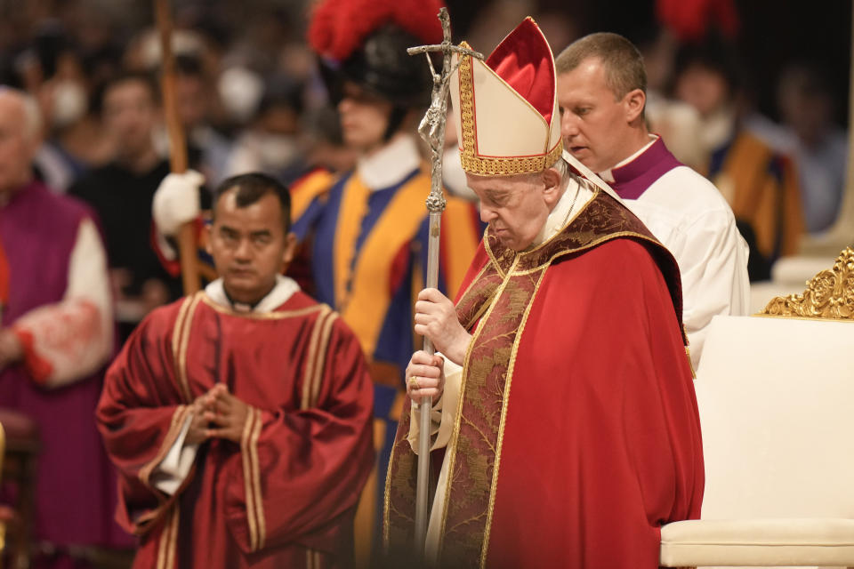 Pope Francis holds the crucifix as he celebrates a Mass on the Solemnity of Saints Peter and Paul, in St. Peter's Basilica at the Vatican, Wednesday, June 29, 2022. (AP Photo/Alessandra Tarantino)