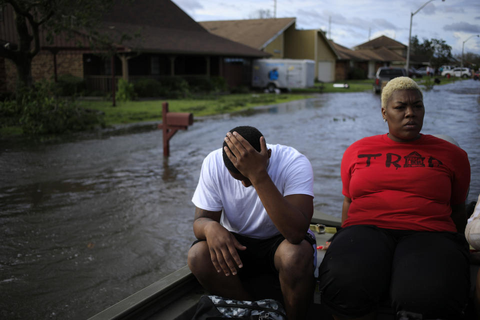 Residents ride in a boat 