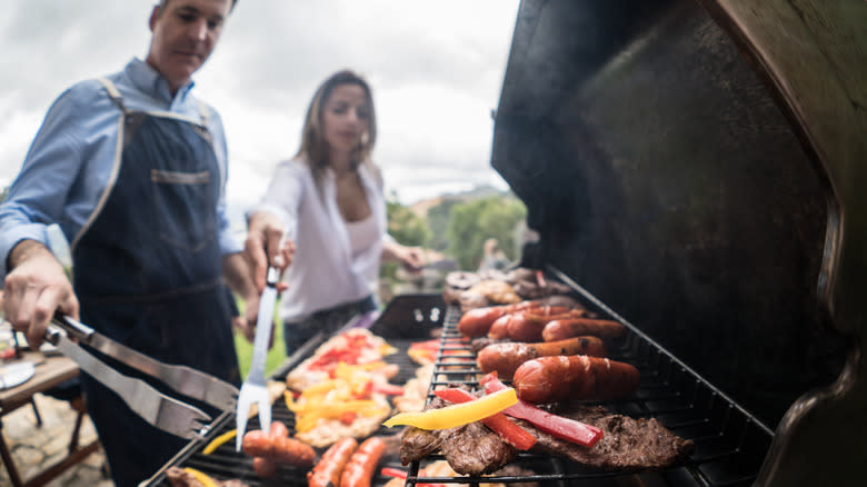 couple grilling food