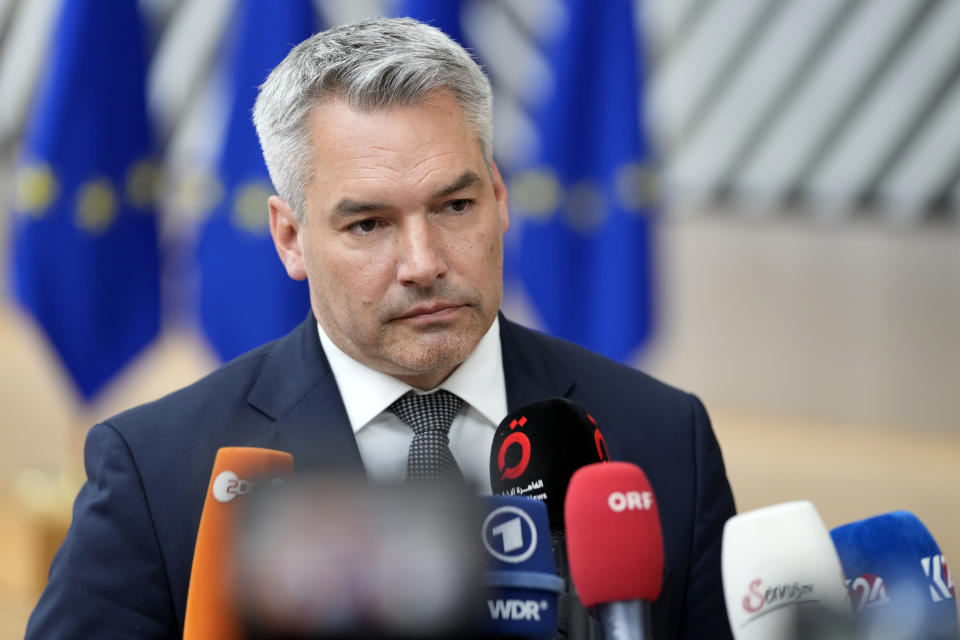 FILE - Austria's Chancellor Karl Nehammer speaks with the media as he arrives for an EU summit at the European Council building in Brussels, Thursday, June 29, 2023. (AP Photo/Virginia Mayo, File)