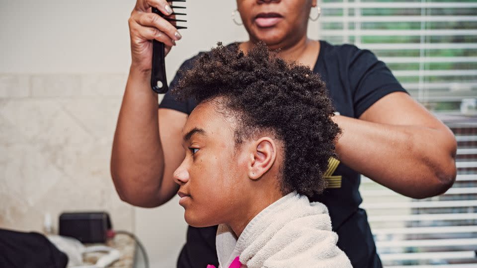 Trina's daughter Zoe enjoys wearing braids, so her mother taught herself how to weave them. - Tomesha Faxio