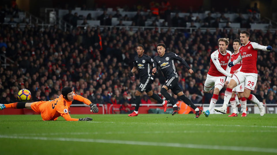 Jesse Lingard finishes the first of his two, and the second of Manchester United’s three goals on Saturday at Arsenal. (Getty)