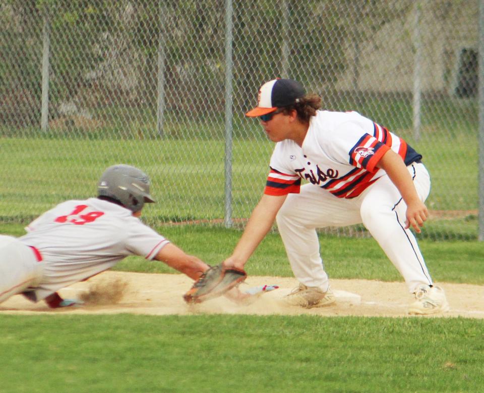 Pontiac first baseman Zayn Eilts slaps a tag on Ottawa baserunner Jack Henson during Thursday's nonconference game at The Ballpark at Williamson Field. PTHS claimed an 11-0 win as Henry Brummel threw a no-hitter.