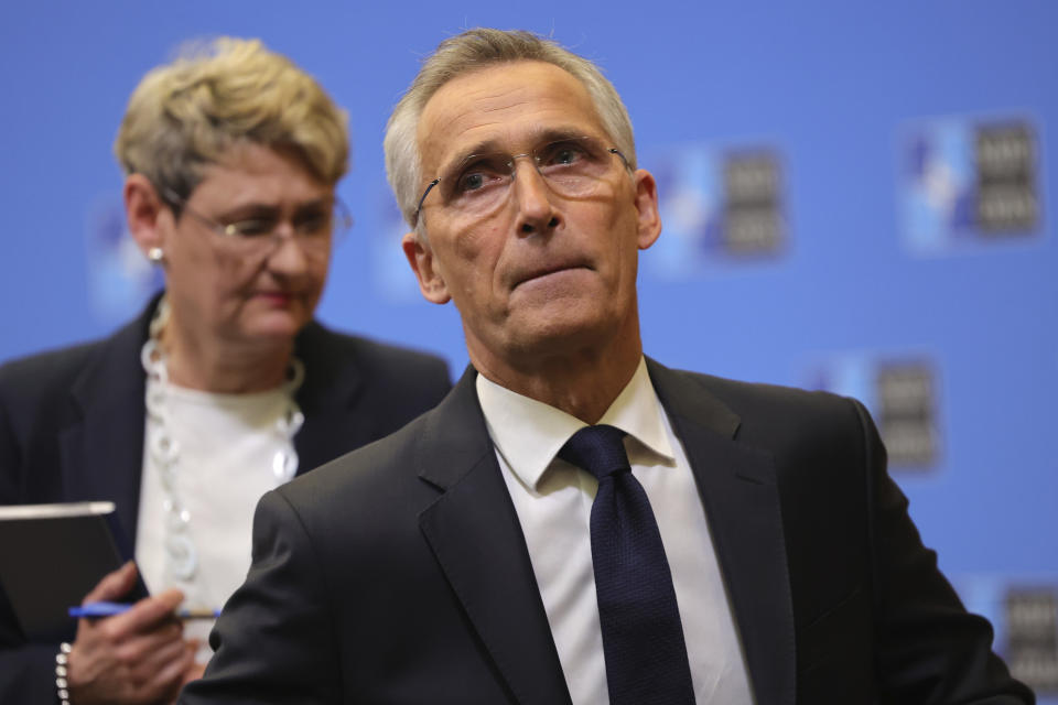 NATO Secretary-General Jens Stoltenberg, followed by NATO Spokeswoman Oana Lungescu, leaves after a press conference at the NATO headquarters, Wednesday, Nov. 16, 2022 in Brussels. NATO Secretary-General Jens Stoltenberg said a missile blast in Poland Tuesday Nov.15, 2022 that killed two people near the border with Ukraine was probably not an attack by Russia. (AP Photo/Olivier Matthys)