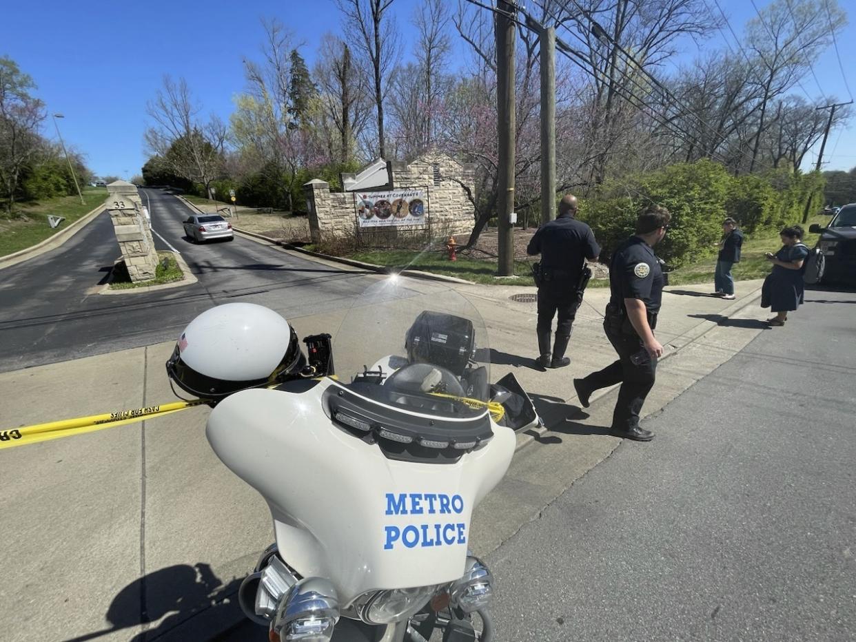 Metro Nashville Police Department officers walk outside of Covenant School, Covenant Presbyterian Church, in Nashville, Tenn. Monday, March 27, 2023. Officials say several children were killed in a shooting at the private Christian grade school in Nashville. The suspect is dead after a confrontation with police. (AP Photo/John Amis)