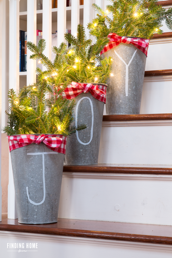 <p>Stuff galvanized flower buckets with fresh pine, draw on a festive message, and light it all up with twinkly lights! See how it's done at <a href="http://findinghomefarms.com/10-minute-christmas-decorating-idea-chalk-pen-galvanized-buckets/" rel="nofollow noopener" target="_blank" data-ylk="slk:Finding Home Farms;elm:context_link;itc:0;sec:content-canvas" class="link ">Finding Home Farms</a>.</p>