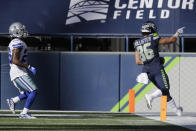 Seattle Seahawks tight end Jacob Hollister, right scores a touchdown past Dallas Cowboys cornerback Daryl Worley, left, during the second half of an NFL football game, Sunday, Sept. 27, 2020, in Seattle. (AP Photo/John Froschauer)