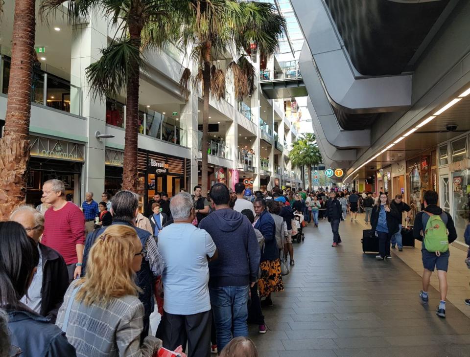 Commuters are pictured here queuing up to use the new Metro line in Sydney.