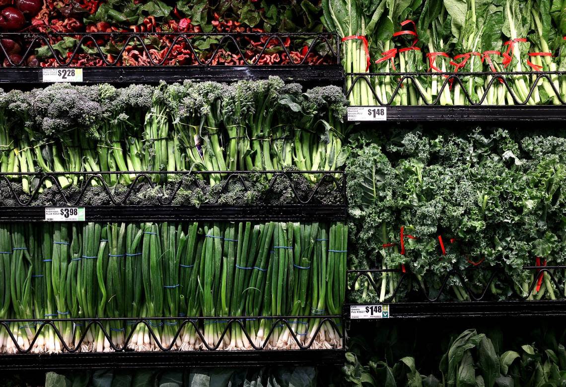 Fresh produce lines a cooler wall at the new Alliance H-E-B. Amanda McCoy/amccoy@star-telegram.com