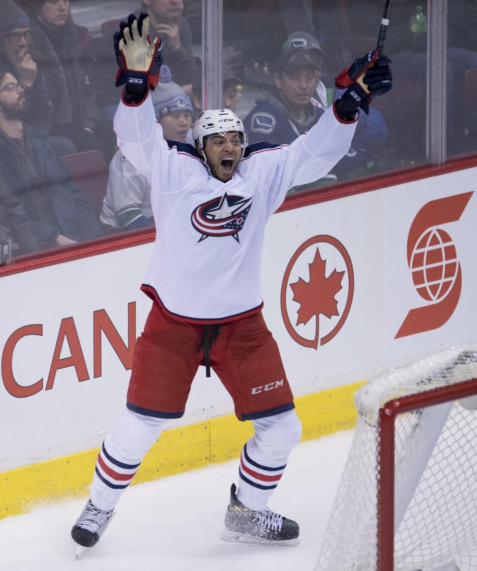 Columbus Blue Jackets defenseman Seth Jones (3) celebrates his goal against the Vancouver Canucks in overtime of an NHL hockey game, Sunday, Dec. 18, 2016 in Vancouver, British Columbia. (Jonathan Hayward/The Canadian Press via AP)