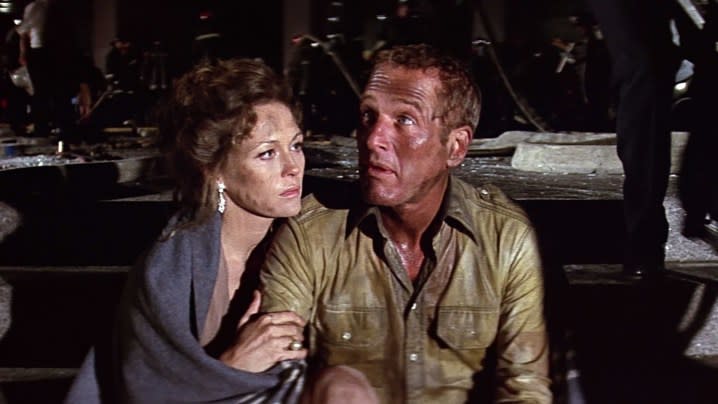 Two characters huddling together in The Towering Inferno.