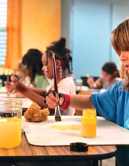 Students paint at Constellation Charter School in Waldo, Florida. An integrated curriculum at the school allows multiple subjects to flow together.