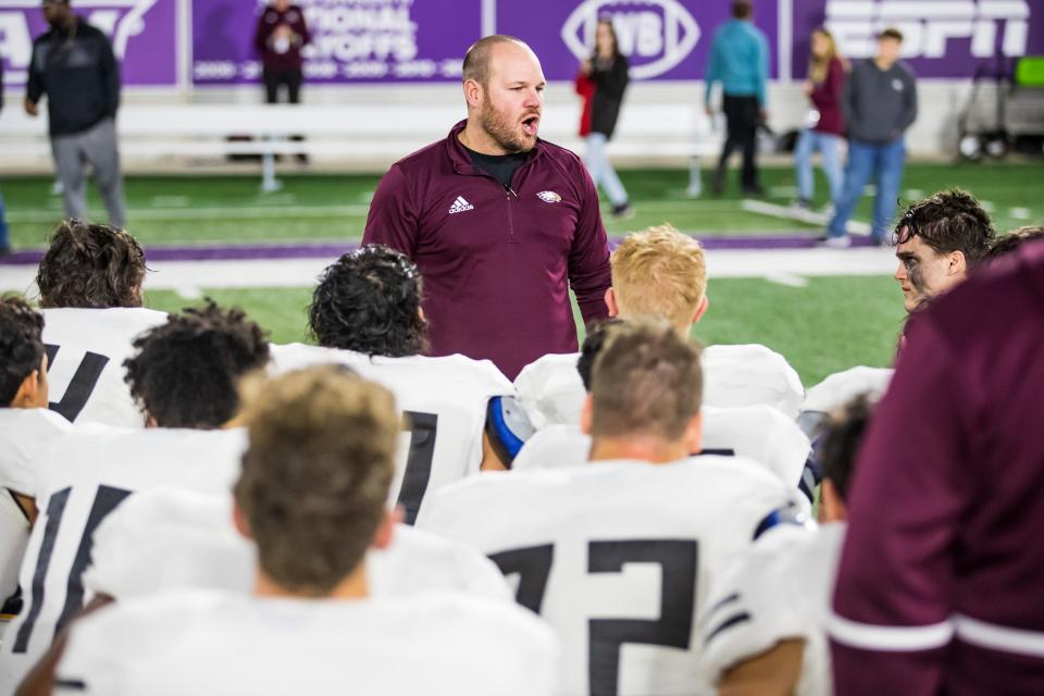 Roosevelt head coach Matt Landers addresses the team after the loss against Gunter during the UIL 3A-D2 State Semifinal on Friday, Dec. 10, 2021, at Anthony Field at Wildcat Stadium in Abilene, Texas.