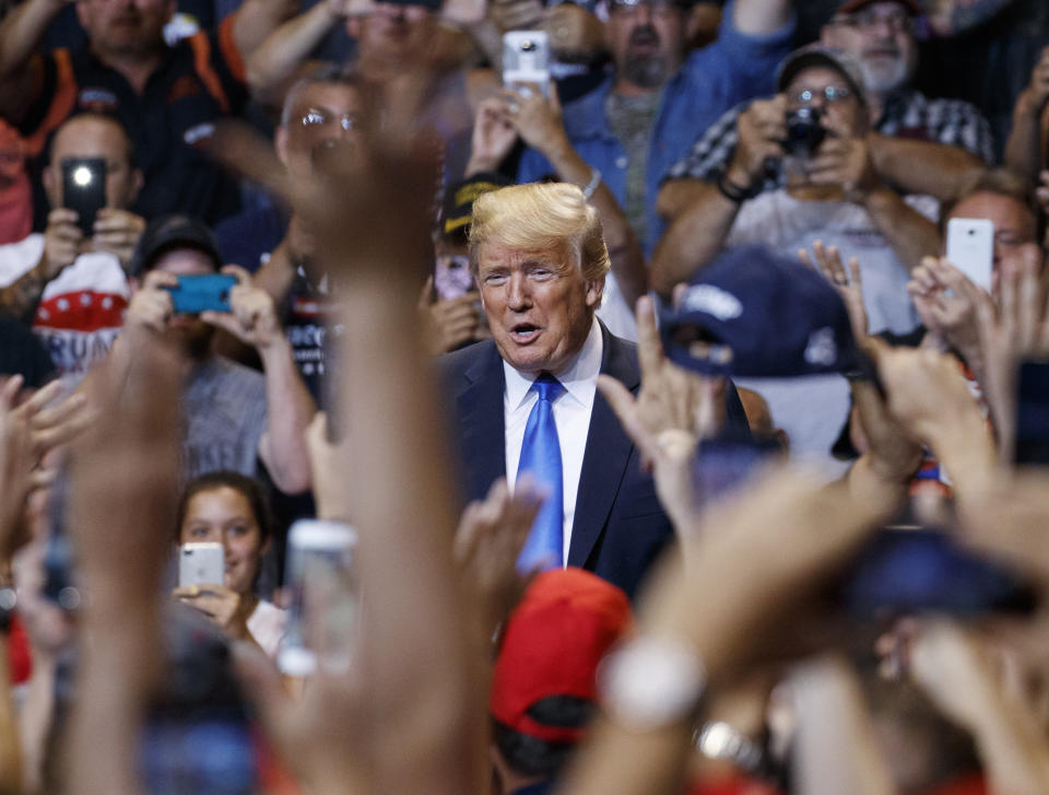 President Donald Trump is cheered as he arrives for a rally, Thursday, Aug. 2, 2018, at Mohegan Sun Arena at Casey Plaza in Wilkes Barre, Pa.. (AP Photo/Carolyn Kaster)