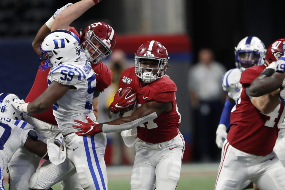 Alabama running back Jerome Ford (27) breaks through the line during the second half an NCAA college football game against Duke, Saturday, Aug. 31, 2019, in Atlanta. Alabama won 42-3. (AP Photo/John Bazemore)