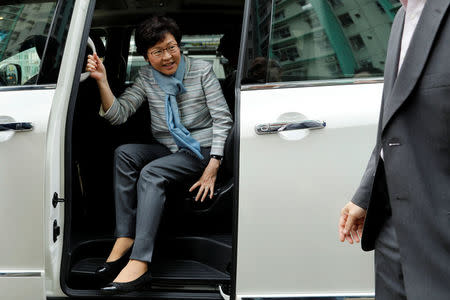 Chief Executive election candidate and former Chief Secretary Carrie Lam alights from a vehicle during an election campaign in Hong Kong, China March 23, 2017. REUTERS/Tyrone Siu