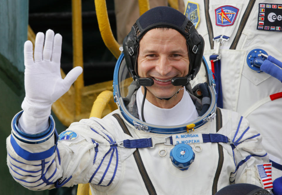 U.S. astronaut Andrew Morgan, crew member of the mission to the International Space Station, ISS, waves as he boards prior to the launch of Soyuz-FG rocket at the Russian leased Baikonur cosmodrome, Kazakhstan, Saturday, July 20, 2019. (AP Photo/Dmitri Lovetsky, Pool)