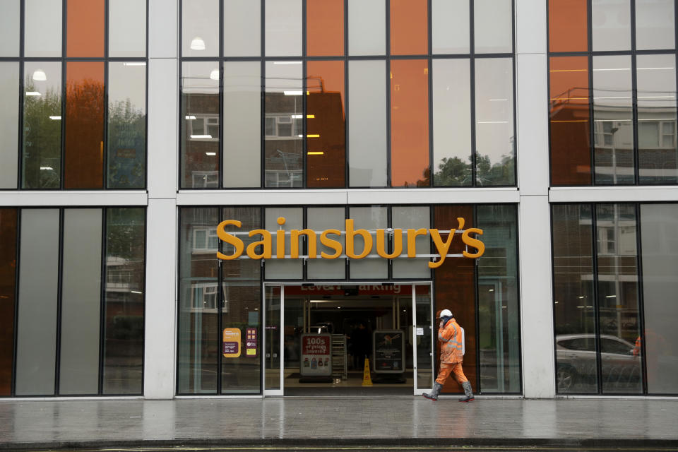 FILE- This April 30, 2018, file photo shows an exterior view of the Sainsbury's flagship store in the Nine Elms area of London. British regulators say the proposed supermarkets merger between Sainsbury's and Walmart's Asda unit would push up prices and reduce quality for shoppers, casting doubt on a deal that would create the country's biggest grocery chain. (AP Photo/Matt Dunham, File)