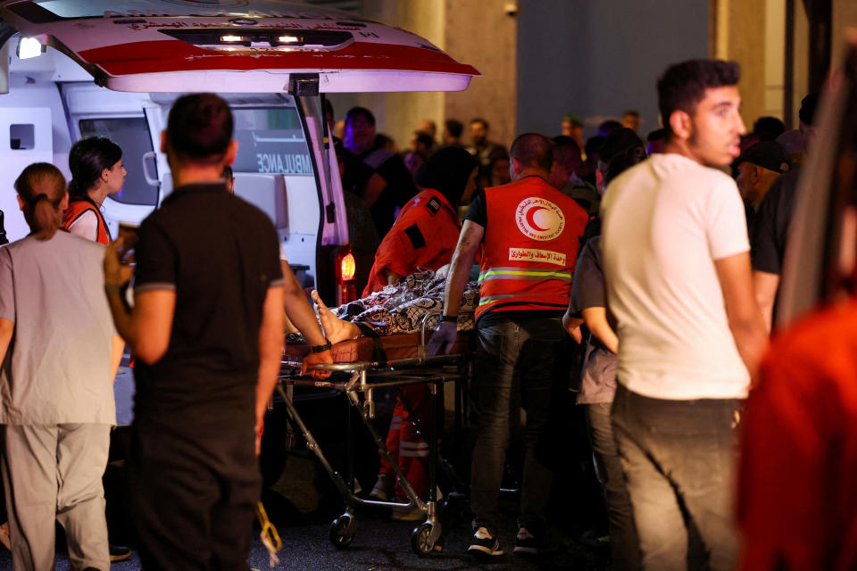 A person is carried on a stretcher outside American University of Beirut Medical Center (AUBMC) as people, including Hezbollah fighters and medics, were wounded and killed when the pagers they use to communicate exploded across Lebanon, according to a security source, in Beirut, Lebanon September 17, 2024. REUTERS/Mohamed Azakir