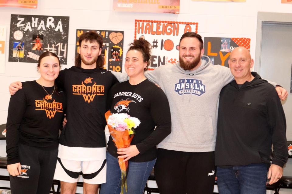 Cookie Leger (second from left) smiles alongside his sister Andrea, mom Shauna, brother Nick and dad Matt, during Gardner's senior night celebrations on February 12, 2024.