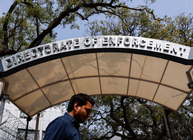 A man walks past the office of Directorate of Enforcement in New Delhi