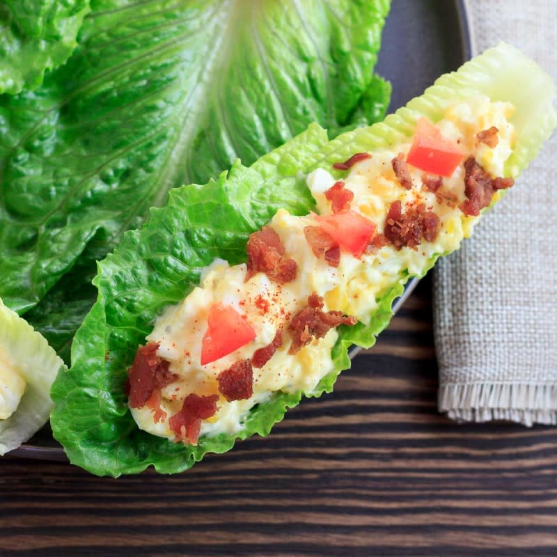 <p>Beauty and the Foodie</p><p>These quick and simple, but very taste lettuce boats make an excellent low-carb, paleo lunch, breakfast or snack.</p><p><strong>Get the recipe:</strong><a href="https://beautyandthefoodie.com/keto-blt-egg-salad-boats/" rel="nofollow noopener" target="_blank" data-ylk="slk:Keto BLT Egg Salad Boats;elm:context_link;itc:0;sec:content-canvas" class="link "> <strong>Keto BLT Egg Salad Boats</strong></a></p>