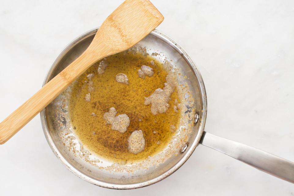 Freshly melted browned butter in a skillet.