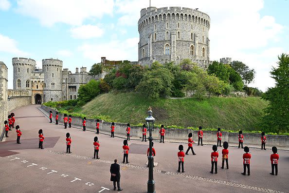 WINDSOR, ENGLAND - SEPTEMBER 19: The Coldstream Guards  outside the Round Tower at Windsor Castle on September 19, 2022 in Windsor, England. The committal service at St George's Chapel, Windsor Castle, took place following the state funeral at Westminster Abbey. A private burial in The King George VI Memorial Chapel followed. Queen Elizabeth II died at Balmoral Castle in Scotland on September 8, 2022, and is succeeded by her eldest son, King Charles III. (Photo by Leon Neal/Getty Images)