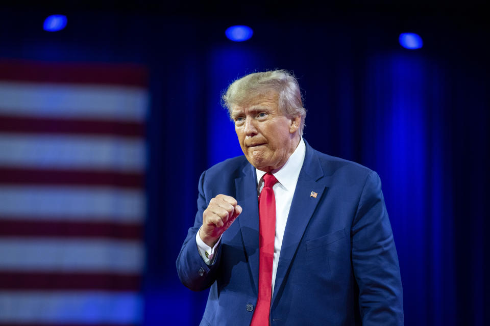 FILE - Former President Donald Trump pumps his fist after speaking at the Conservative Political Action Conference, March 4, 2023, Oxon Hill, Md. The Manhattan district attorney's office appears to be getting close to a decision on whether to charge Donald Trump over hush-money payments to Stormy Daniels during his 2016 presidential campaign. (AP Photo/Alex Brandon, File)