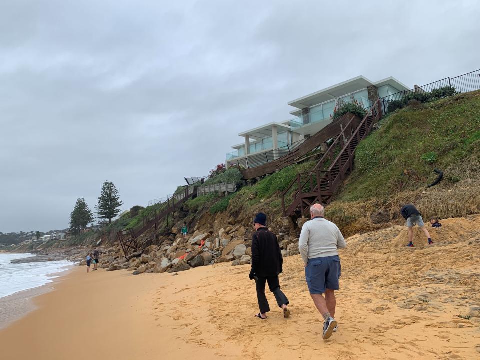 Pictured is a home backing onto Wamberal Beach on a cliff edge.