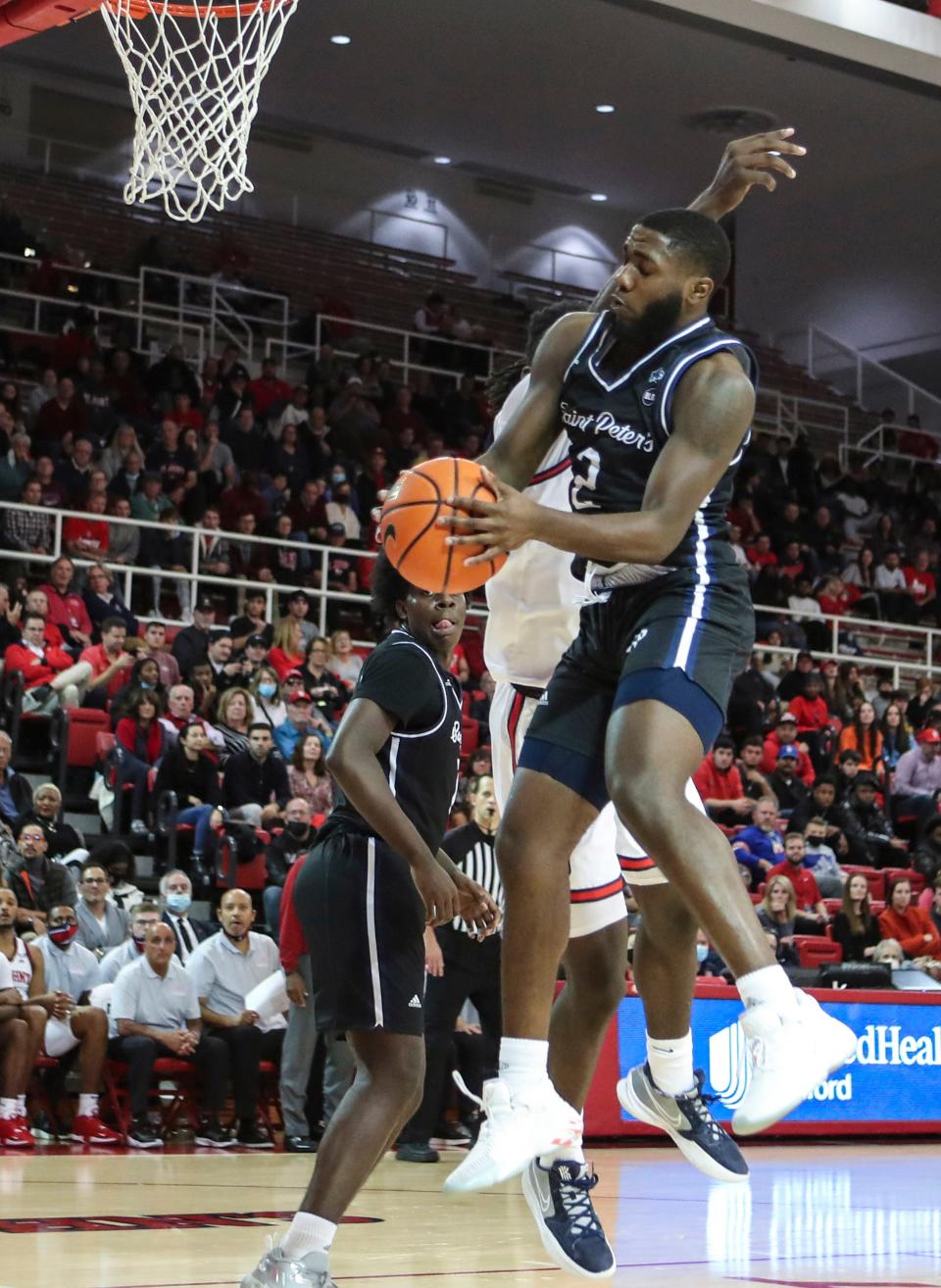 Marty Silvera of Worcester grabs a rebound for St. Peter's in a game last season at St. John's.