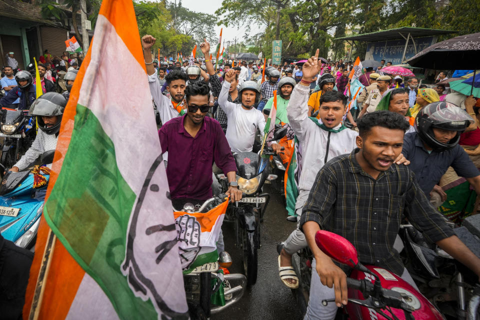 India's Congress party supporters take part in a bike rally during an election campaign ahead of national elections in Titabor in upper Assam, India, Tuesday, April 16, 2024. (AP Photo/Anupam Nath)