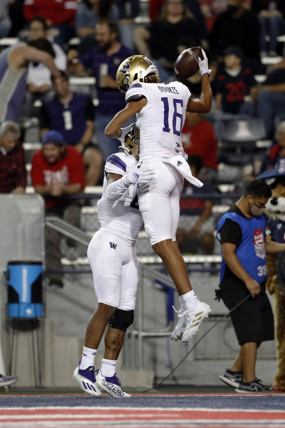 Washington wide receiver Rome Odunze (16) celebrates with running back Cameron Davis after scoring a touchdown during the fourth quarter of the team's NCAA college football game against Arizona on Friday, Oct. 22, 2021, in Tucson, Ariz. (AP Photo/Chris Coduto)