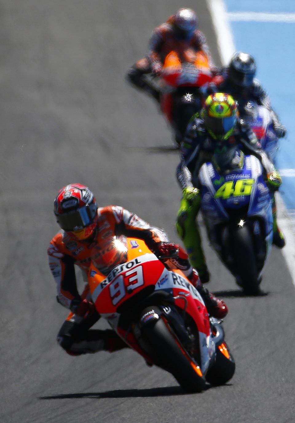 MotoGP raider Marc Marquez of Spain leads the race followed by Valentino Rossi of Italy and Jorge Lorenzo of Spain during the Spain's Motorcycle Grand Prix at the Jerez race track on Sunday, May 4, 2014 in Jerez de la Frontera, southern Spain. (AP Photo/Miguel Angel Morenatti)