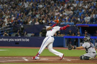 Toronto Blue Jays first baseman Vladimir Guerrero Jr. (27) breaks off a piece of his bat against the Houston Astros during the first inning of a baseball game in Toronto on Wednesday, June 7, 2023. (Andrew Lahodynskyj/The Canadian Press via AP)