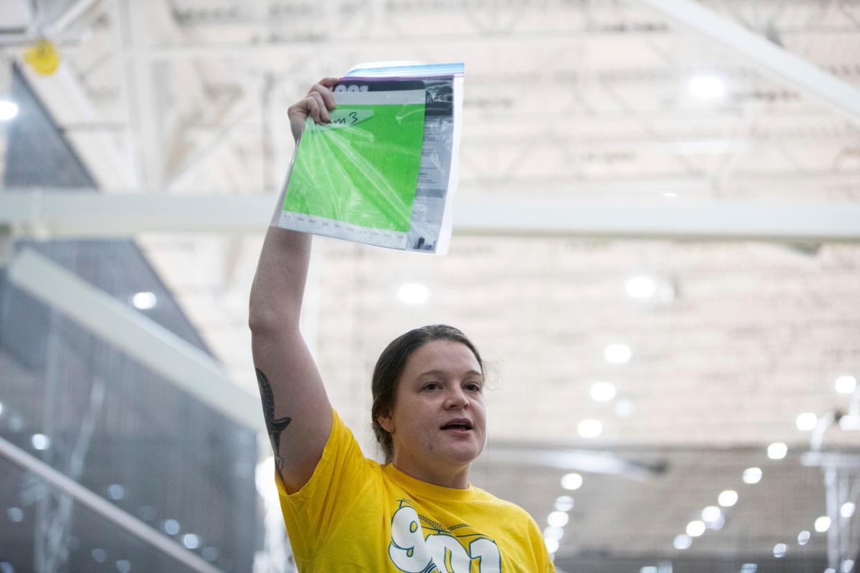 Kirsten Hipkins, Consortium of Care coordinated entry director with Community Alliance for the Homeless, gives directions to volunteers at the events headquarters in the Memphis Sports and Events Center before the start of the annual point-in-time count in Memphis, Tenn., on Thursday, January 25, 2024.