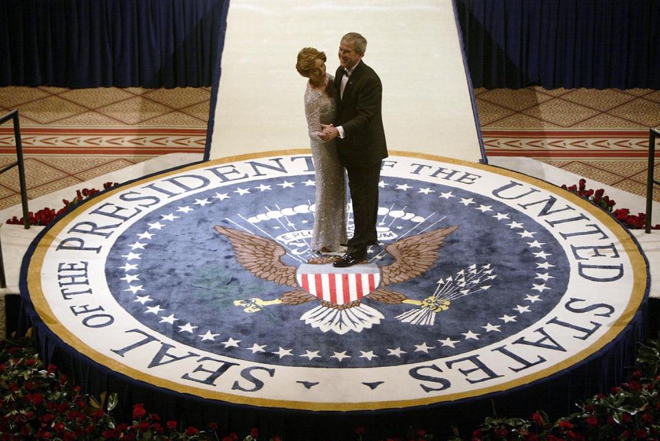 <p>President and First Lady Bush attend the inaugural ball on the night of his second Presidential inauguration in 2005. To celebrate, they shared a dance on the Presidential seal at their event. </p>