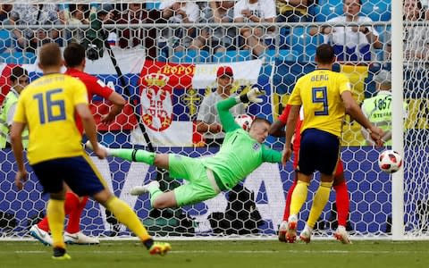 England's Jordan Pickford saves a header from Sweden's Marcus Berg  - Credit: REUTERS/Max Rossi