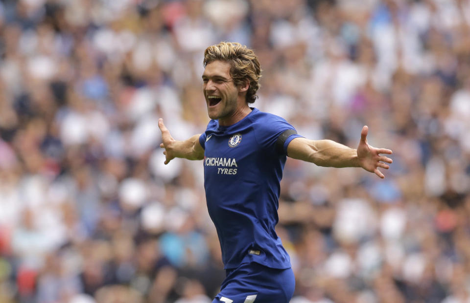 Chelsea’s Marcos Alonso celebrates after scoring the opening goal of the game during their English Premier League soccer match between Tottenham Hotspur and Chelsea at Wembley stadium in London, Sunday Aug. 20, 2017. (AP Photo/Alastair Grant)