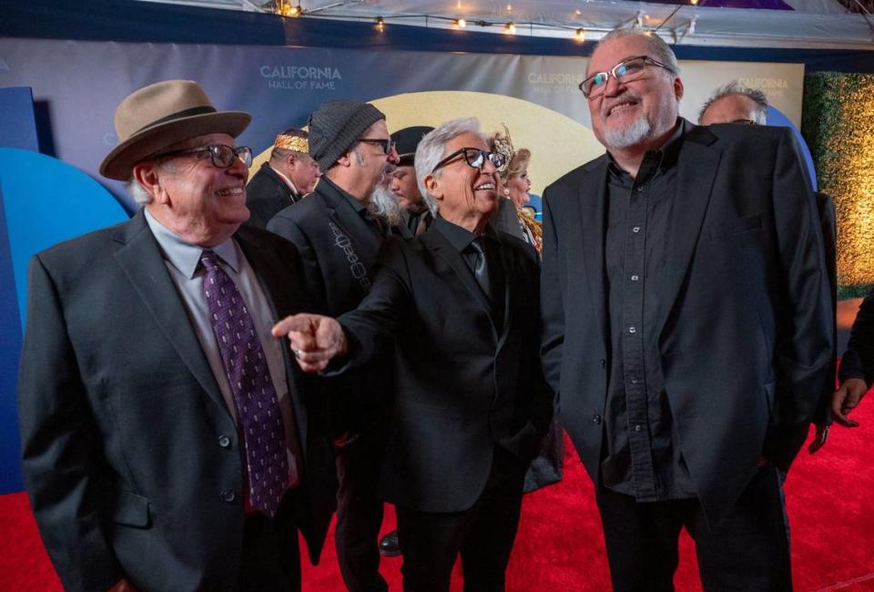 Members of the iconic Chicano rock band Los Lobos stand on the red carpet on Tuesday as one of this year’s inductees into the California Hall of Fame. Lezlie Sterling/lsterling@sacbee.com