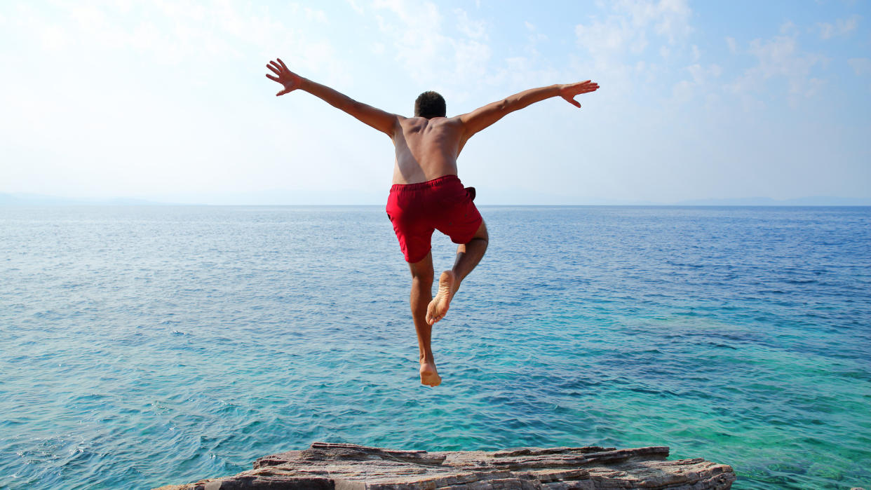 Young man diving.