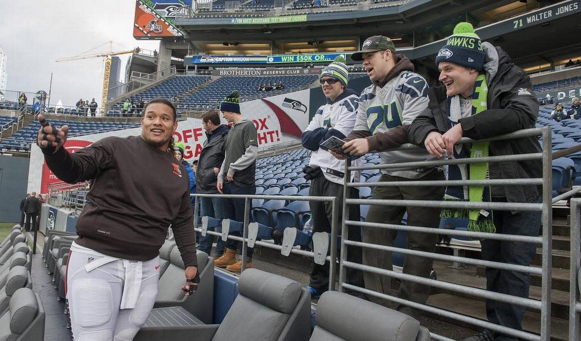Former UW defensive standout Danny Shelton, left, shares laughs with fellow 2011 grads of Auburn High in Seattle on Sunday, Dec. 20, 2015. Shelton also played football at Auburn with Aaron McMahon, right, and Andrew and Tilden Samson. Shelton, a rookie, was drafted in the first round by the Cleveland Browns.