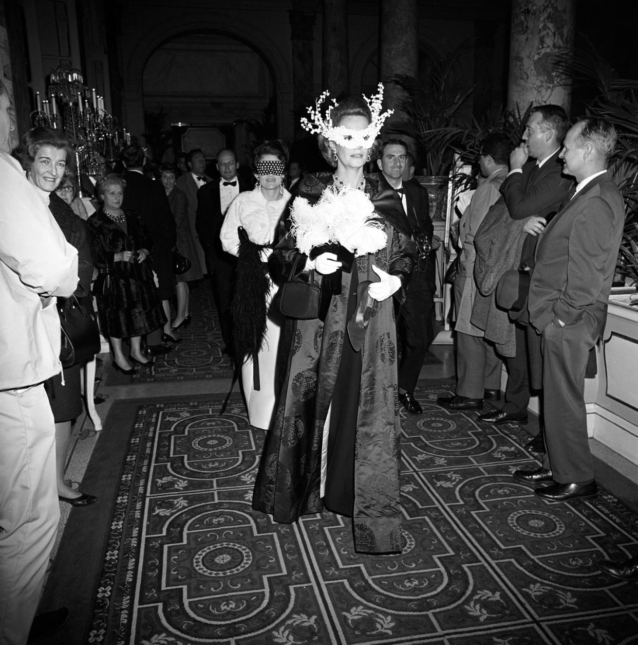 women in masks arriving at truman capote's black and white ball in the grand ballroom at the plaza hotel in new york city photo by fairchild archivepenske media via getty images