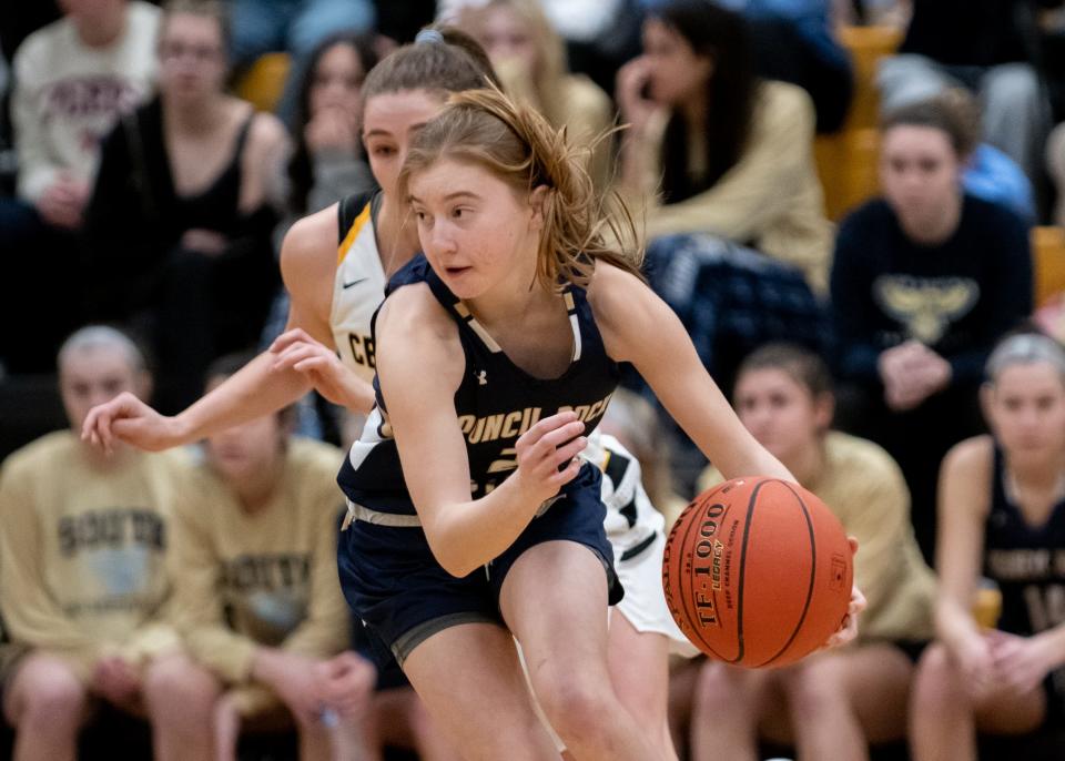 Council Rock South's Liliana Metrick eyes a path as she drives down the lane during a District One Class 6A first round playoff game at Central Bucks West on Friday, February 18, 2022. The Bucks advance to the second round after narrowly defeating the Golden Hawks 52-50.