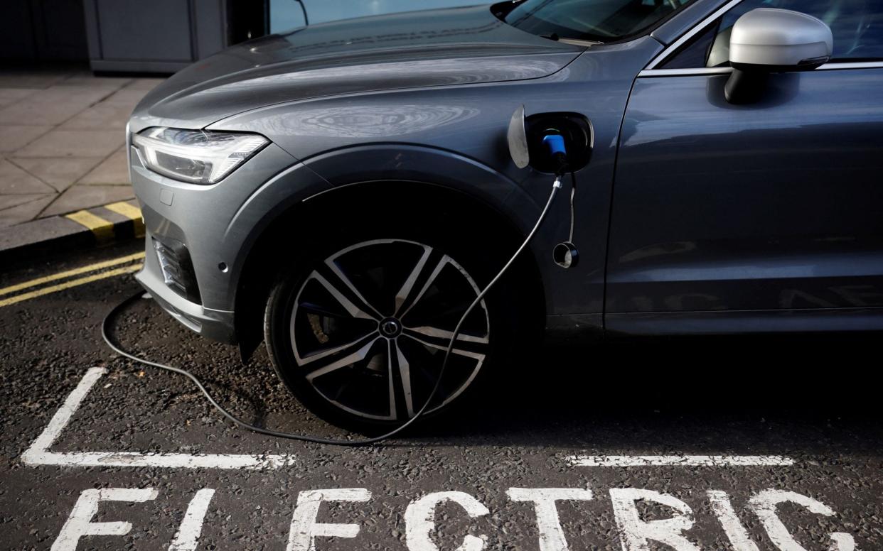 Electric car charging - Tolga Akmen/AFP