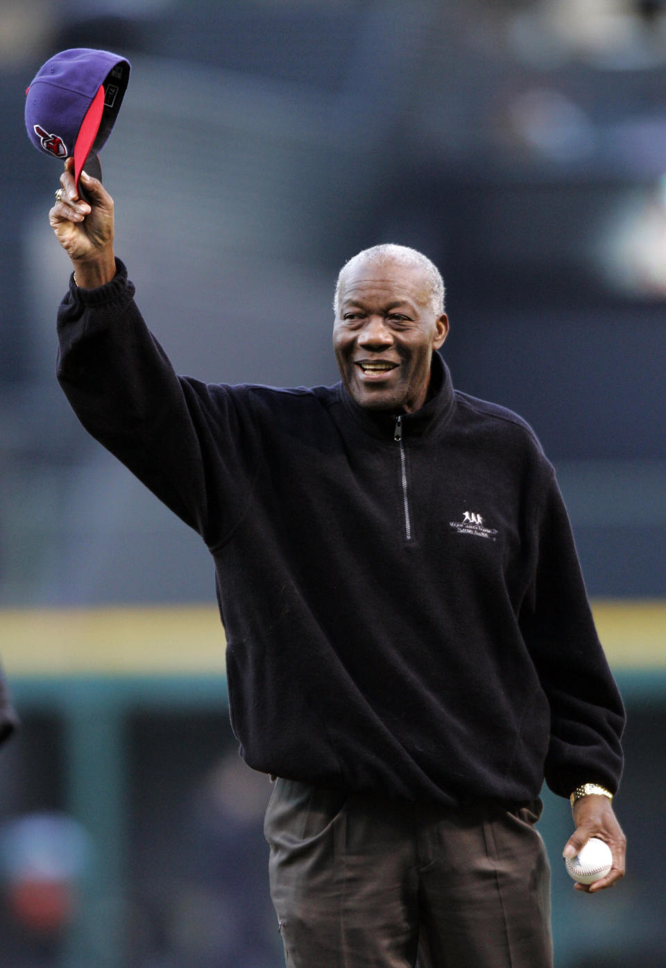 FILE - In this April 14, 2008, file photo, former Cleveland Indians pitcher Jim "Mudcat" Grant waves to the crowd before throwing out the ceremonial pitch before the Indians hosted the Boston Red Sox in a baseball game in Cleveland. Grant, the first Black 20-game winner in the major leagues and a key part of Minnesota's first World Series team in 1965, has died, the Twins announced Saturday, June 12, 2021. He was 85. (AP Photo/Mark Duncan, File)