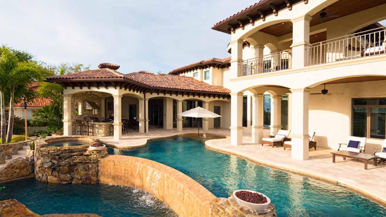 A huge house with a large swimming pool